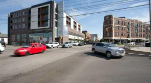a busy city street with cars driving on the street at CozySuites at 747 Apts in Indianapolis