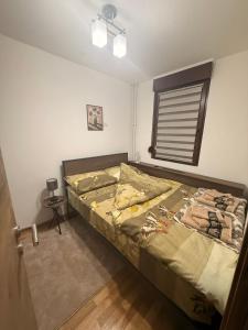 En eller flere senge i et værelse på Gohemi Apartments