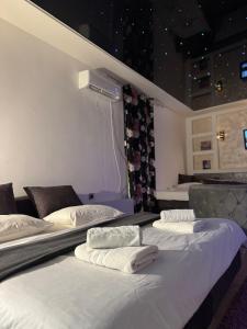 En eller flere senge i et værelse på Moonlight Apartment