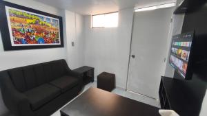 a living room with a couch and a table at Departamento centro in Andahuaylas