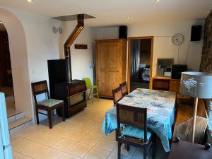a living room with a table and chairs at Appartement Chalet Nerboux in Morillon +2 photos