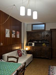 a bedroom with a bed and a table in it at Rifugio delle Emozioni in Grange Sises