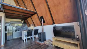 TV a/nebo společenská místnost v ubytování Alpina 406