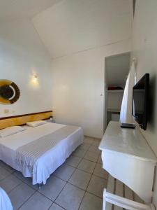 Et tv og/eller underholdning på Pousada Chalés Jardim das Aguas