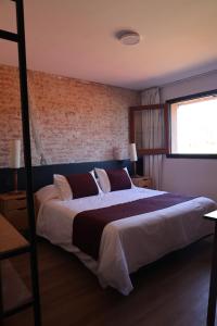 En eller flere senge i et værelse på Hosteria Del Pescador + 14 billeder