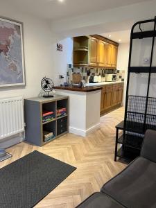 a kitchen with a counter and a counter top at Epworth Cottage in Crich