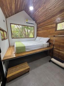 Postel nebo postele na pokoji v ubytování Tiny House Surf Nature and Relaxation