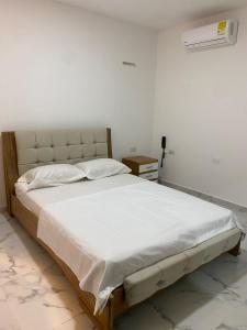 En eller flere senge i et værelse på Hotel Santa Ana