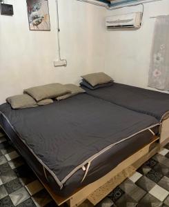 En eller flere senge i et værelse på SABAYA HOMESTAY + 11 billeder