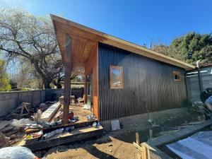 a house under construction with the front of it at Alaska cabin in Choroico