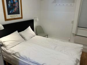 En eller flere senge i et værelse på 4 person holiday home in Eidsvåg