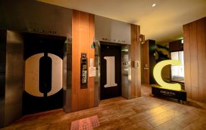 a lobby with two elevators in a building at CHECK inn Taipei Songjiang in Taipei +17 photos
