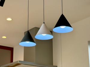 three lights hanging from the ceiling in a kitchen at Futtsu Pool Villa A&F -富津プールヴィラ A&F- in Futtsu