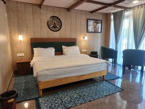 a bedroom with a large bed in a room at Shivir Aranya - Wilderness Resort Sariska in Alwar +137 photos