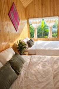 En eller flere senge i et værelse på Chúng Pả Homestay