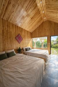 En eller flere senge i et værelse på Chúng Pả Homestay