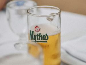 a glass of beer sitting on a table at Hyde Perth in Perth