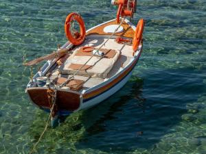 a small boat in the water withotation devices on it at Hyde Perth in Perth +8 photos