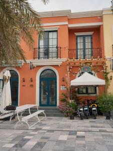 an orange building with bikes parked in front of it at PKseahome 3 bedroom 4 toilet Novaworld in Phan Thiet