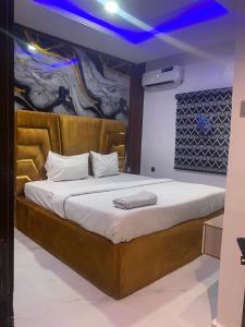 a bedroom with a large bed in a room at Dee Rocket Hotel & Lounge in Ibadan +70 photos
