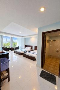 En eller flere senge i et værelse på Khu Nghỉ Dưỡng Đoàn 298 Khu 7 Tầng