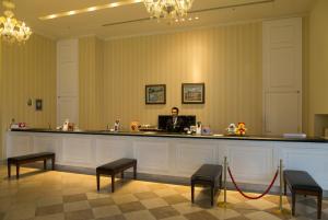 a man sitting at a bar in a room at Hotel Nikko Huis Ten Bosch in Sasebo +48 photos