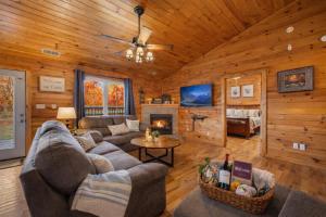 a living room with a couch and a fireplace at One Level, Pet Friendly, Huge Fenced in Yard, Views, EasyRoads, Pool Table, Spa, Theater, Outdoor fun in Sevierville +46 photos