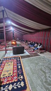a large room with many carpets on the floor at Bubble RumCamp in Wadi Rum +162 photos