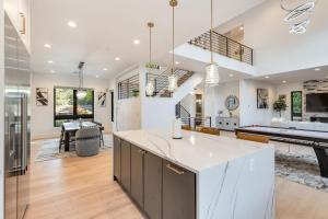a kitchen and living room with a pool table at BELL115*: Bellevue Splendor in Bellevue