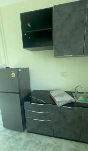 Et tv og/eller underholdning på Patong View by Thainish Res - Accommodation for Rentals