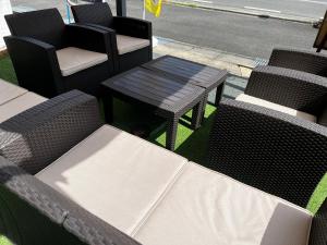 a group of chairs and a table on a patio at Hitsujipotchi-Kyoto in Yatsuai +6 photos