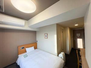 Postel nebo postele na pokoji v ubytování Hotel Route-Inn Nishinasuno