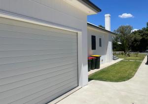 a garage door on the side of a house at Spring Haven in Wagga Wagga