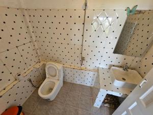 a bathroom with a toilet and a sink at Top Views Retreat in Koh Rong Island +13 photos