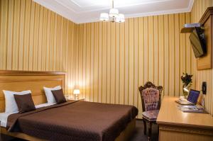 Postel nebo postele na pokoji v ubytování Dvoryanskiy Hotel