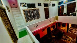 a view of a room with colorful floors and stairs at Hotel White House - A Family Homestay in Pushkar