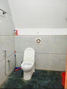 Et badeværelse på Mullassery H Stay