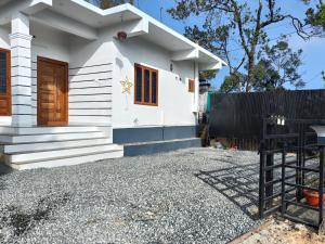 a house being built with a gravel driveway at Eva homes in Vagamon