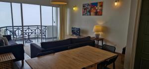 a living room with a couch and a table at B43A1 Silverpark 4th floor Best Mountain view in Bukit Fraser