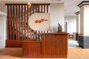 an office with a staircase and a desk and a podium at Cove Puspa Canggu in Canggu
