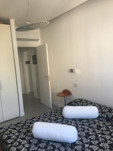 a room with a bed with two pillows on it at Casa Maria in Salerno