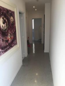 an empty hallway with a painting on the wall at Casa Maria in Salerno