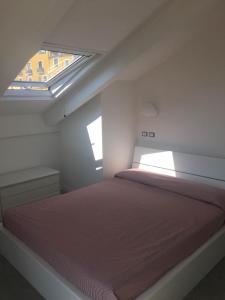 a bedroom with a bed and a window at Casa Maria in Salerno