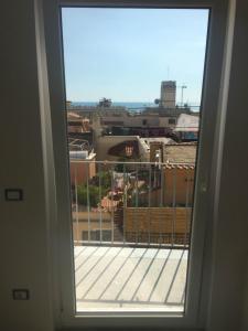 a window with a view of a city at Casa Maria in Salerno