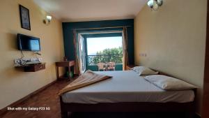 En eller flere senge i et værelse på NSN Home stay