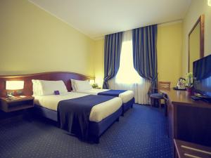 Postel nebo postele na pokoji v ubytování Mercure Genova San Biagio + 108 fotografií
