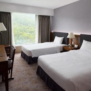 En eller flere senge i et værelse på The K Hotel Gyeongju