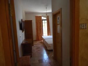 TV a/nebo společenská místnost v ubytování Hotel Antequera Rural Fortes La Nuit