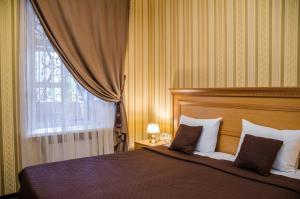 Postel nebo postele na pokoji v ubytování Dvoryanskiy Hotel