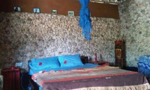 Kama o mga kama sa kuwarto sa Bahati Diani House Glamping